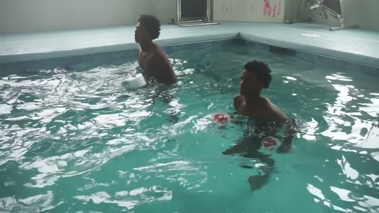 Student athletes doing aquatic active recovery therapy in the NeoFit recovery pool